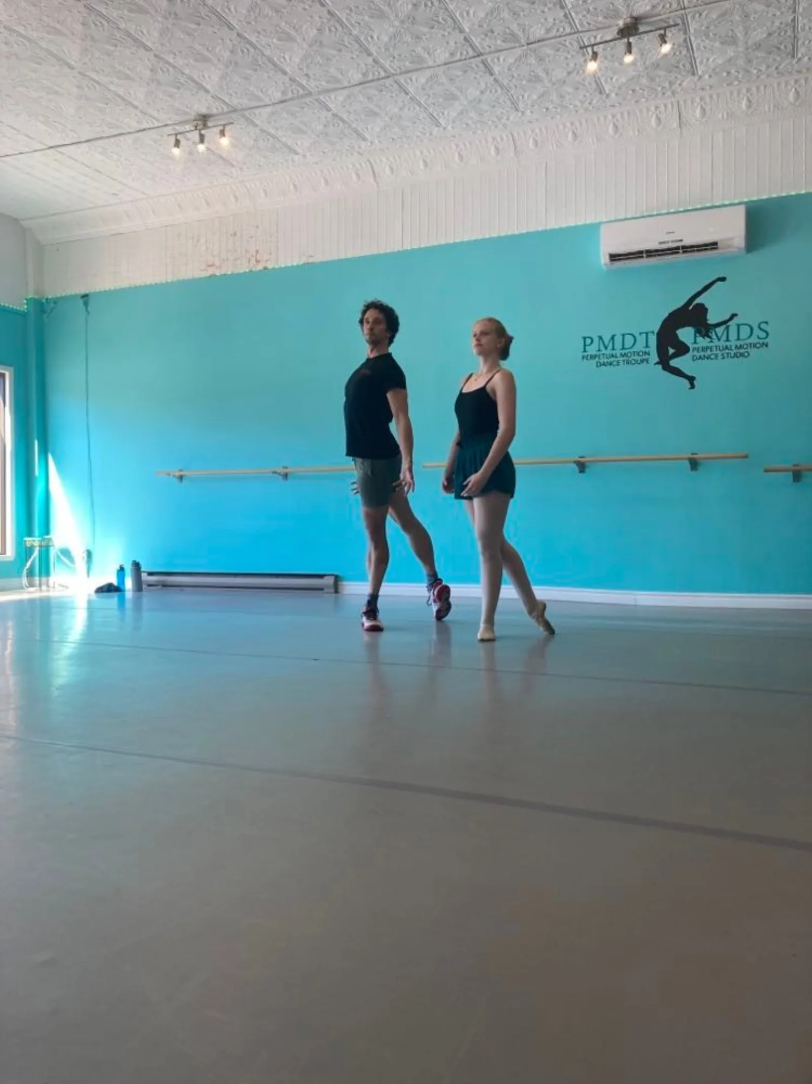 Kealan McLaughlin with a student in the Perpetual Motion Dance Studio