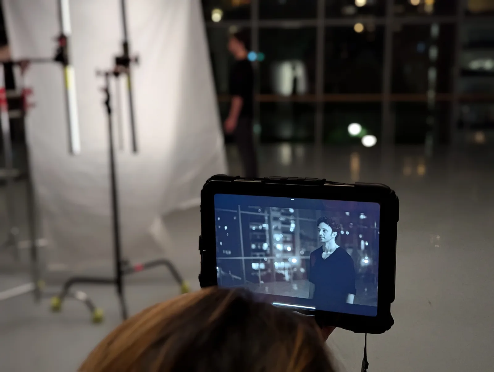 Behind the scenes: reviewing a take on a monitor during a night shoot